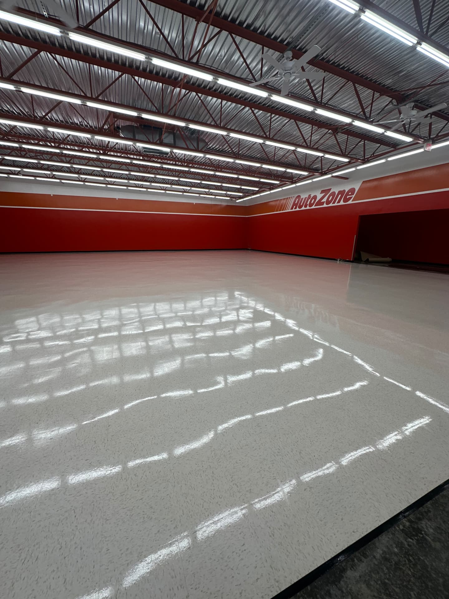 Freshly installed VCT flooring in an AutoZone store